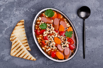Stewed beans with sausages