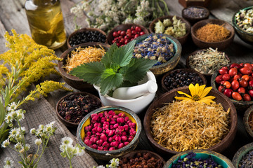 Herbs medicine and vintage wooden background