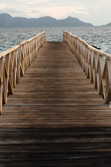 Fototapeta premium Wooden bridge during the sunrise near the Bum bum island in Semporna, Borneo Sabah.