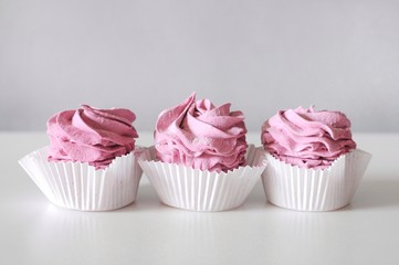 Homemade marshmallow berry zephyr on white background