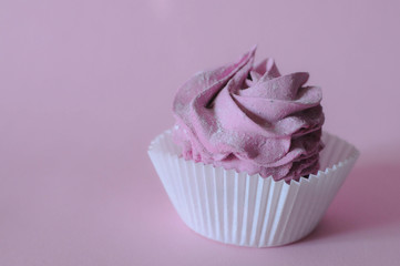 Homemade marshmallow berry zephyr on pink background