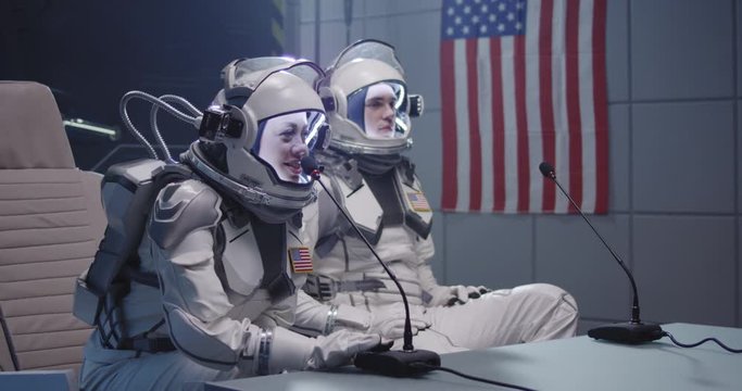 Astronauts talking at pre-flight press conference