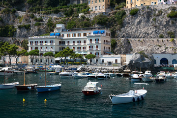 Fototapeta na wymiar Boat pier on the shore of the city of Amalfi in Italy