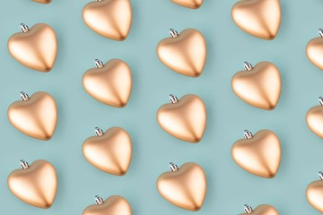 Seamless background from golden hearts. Christmas pattern.