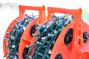 stringed Christmas lights in storage on spool            