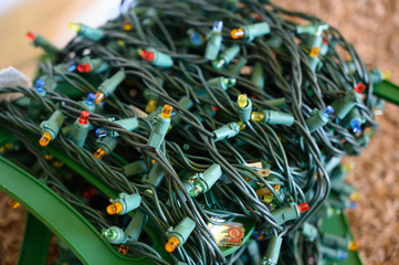stringed Christmas lights in storage on spool