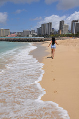 Girl Running on Hawaii Beach