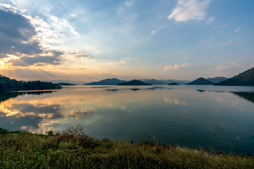 beautiful blue sky green forest mountains lake view at Kaeng Krachan National Park, Thailand.  an idea for backpacker hiking on long weekend or a couple, family holiday activity camping relaxing