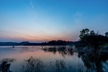 beautiful blue sky green forest mountains lake view at Kaeng Krachan National Park, Thailand.  an idea for backpacker hiking on long weekend or a couple, family holiday activity camping relaxing