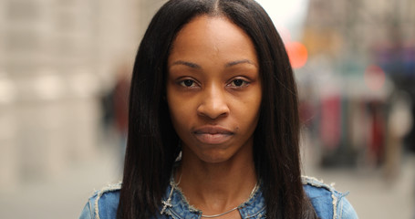 Young black woman in city face portrait