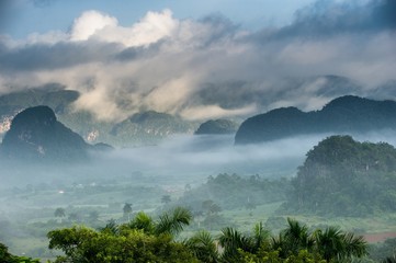 View of Vinales valley at sunrise. Aerial View of the Vinales Valley in Cuba. Morning twilight and fog. Fog at dawn in the Valley of Vinales in Pinar del Rio, famous for tobacco plantations