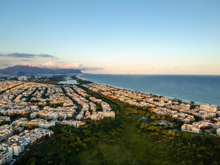 aerial landscape photo of Recreio dos Bandeirantes beach during sunset, with views of Chico Mendes park