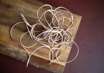 leather cord  on wooden background