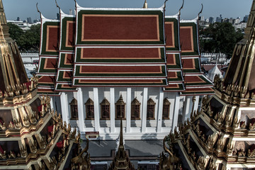 Fototapeta premium Symmetry view of Prasart Metal Palace beyond the Ratchanaddaram temple.