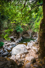 take a boat to beautiful blue sky green forest mountains lake view at Khun Dan Prakarn Chon Dam waterfall,  nakhon nayok, Thailand. an idea for backpacker hiking or camping on long weekend holiday