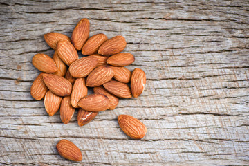Almonds on rustic wooden background top view - Close up almond nuts natural protein food and for snack