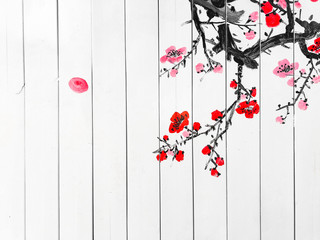 Chinese ink paintings of plum blossoms are painted on white wooden board