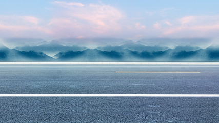 Seaside highway, distant mountain as the background material for the car advertisement.