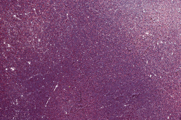 Textured color wall is purple, paint splashes are white. The background photo.