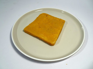 Peanut butter spread on white sliced bread