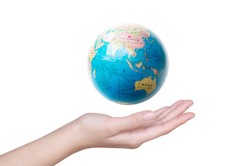 Close-up of a hand holding a globe.