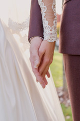 hands of wedding couple  in love. Relationship, love and tenderness concept