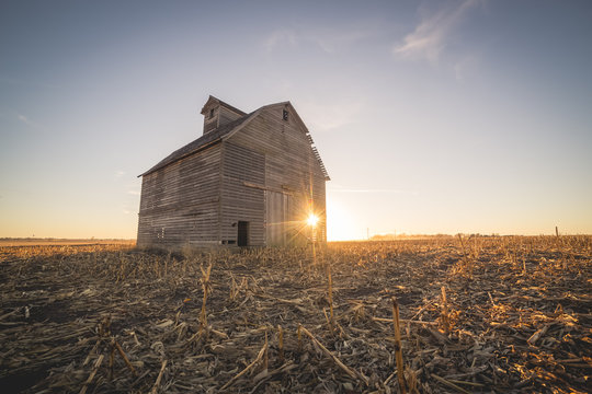 sunset abandoned farm house in the fall