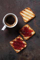 Toasted bread with jam and coffee