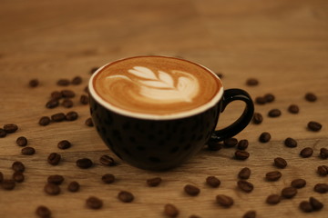 Coffee Cup - Coffee in a black cup isolated on a wooden background - Cappuccino Latte Espresso Macchiato  