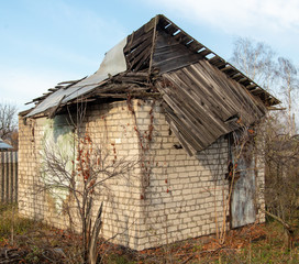 Fototapeta na wymiar Old broken roof on a country house