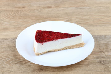  cheesecake with cherry jelly - Strawberry cheese cake isolated on a wooden background 