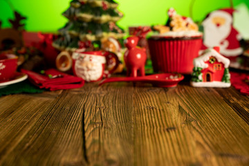 Christmas time. Christmas tableware and decorations. Red and brown colors. Rustic wooden background.