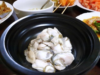 Thai food style, Fresh Oysters on black bowl as a background, ready for eat or serving, Selective focus