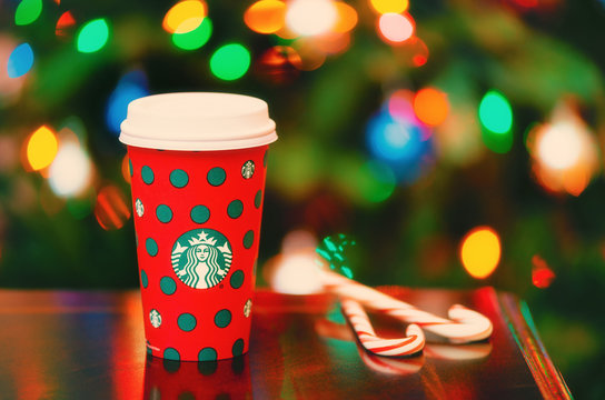 Starbucks popular holiday beverage, served in the new 2019 designed holiday cup on November 28, 2019 in Dallas, Texas. Christmas background.
