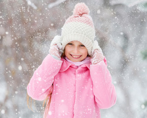 Girl grinning happily in the forest