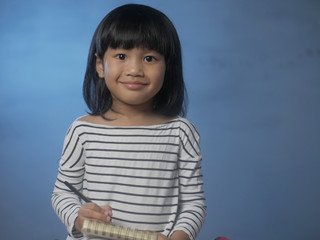 Little Girl Writing on Notepad