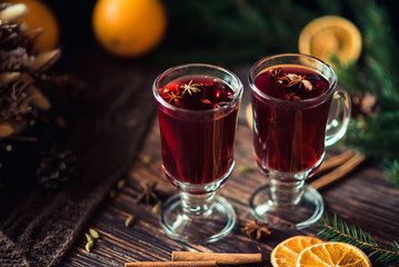 Christmas holiday hot drink mulled wine in glasses on a wooden table