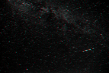 shooting star against the dark starry sky