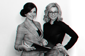 two young successful businesswoman girls with attractive smiles