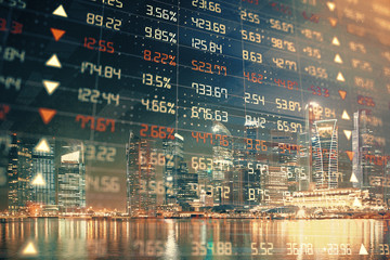Fototapeta premium Financial chart on city scape with tall buildings background multi exposure. Analysis concept.