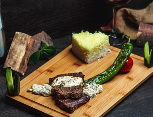 meat with creamy mushroom sauce and rice
