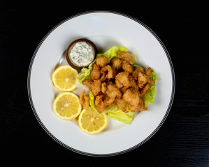 fried shrimp with mushroom sauce and lemon juice
