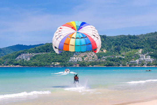 Parasailing. A motorboat with parachute, prepared for parasailing on the sea. Water sport, fun.