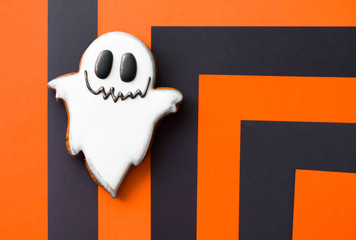 Halloween conten parties and decorations. Black-orange background and gingerbread cookies.