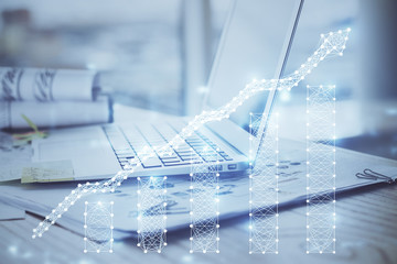 Forex market chart hologram and personal computer background. Double exposure. Concept of investment.