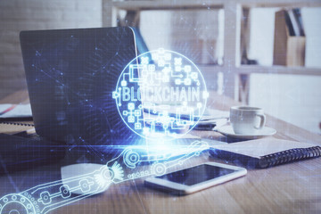 Multi exposure of blockchain theme hologram and table with computer background. Concept of bitcoin...