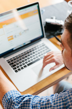 Man working with laptop at home