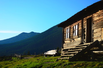 Fototapeta premium Summer landscape with a lonely house in the Ukrainian Carpathians.