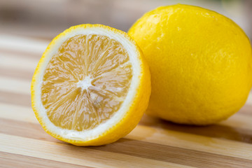 The cut lemon is on the table
