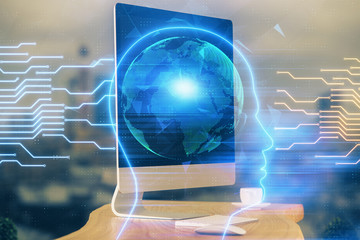 Double exposure of table with computer and brain hologram. Data innovation concept.